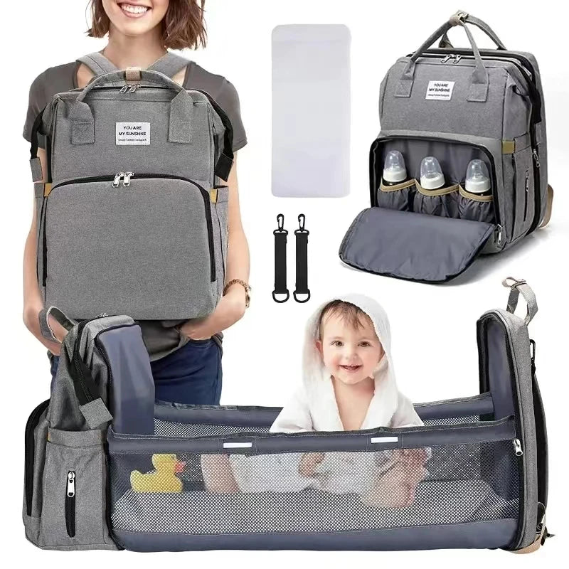 Foldable bed diaper bag with changing station